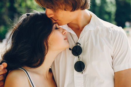Cute couple in a summer parkの写真素材