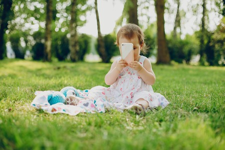 Little girl is resting in the parkの写真素材