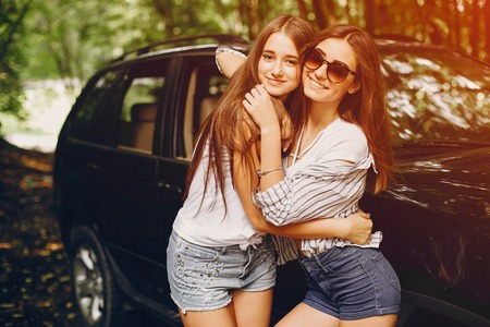 Two girls near car