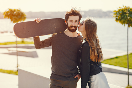 couple with skateの写真素材