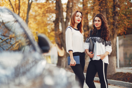 Girls are walking on the streets of the cityの写真素材