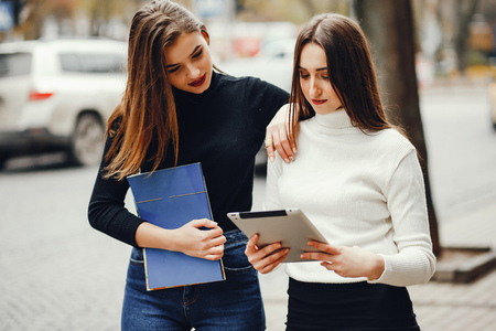 Beautiful girls in a cityの写真素材