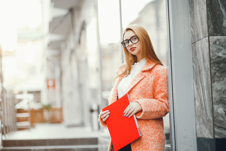 Beautiful girl in a cityの写真素材