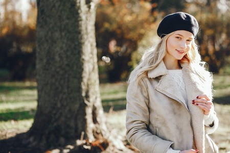 Elegant cute blonde in a autumn cityの写真素材