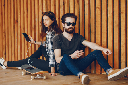 Couple sitting near wallの写真素材
