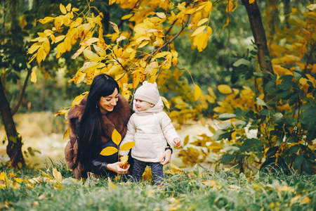 Family in a autumn parkの写真素材