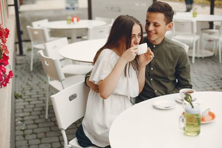 Beautiful couple spend time in a summer cityの写真素材