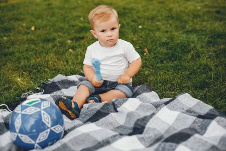 Cute little boy playing in a parkの写真素材