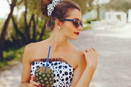 Young and pretty girl in a summer park