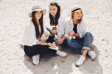 Three pretty girls in a summer park