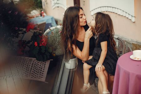 Cute and stylish family in a summer cityの写真素材