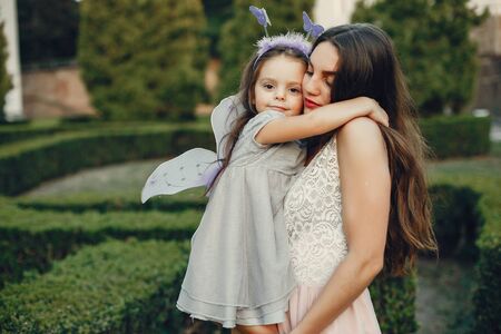 Cute and stylish family in a summer parkの写真素材