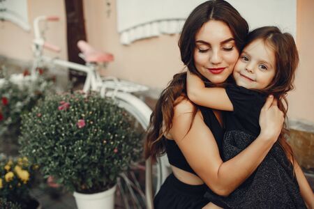 Cute and stylish family in a summer cityの写真素材
