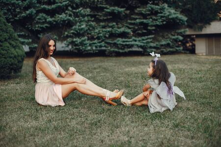 Cute and stylish family in a summer parkの写真素材