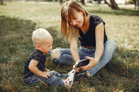 Mother with son playing in a summer park