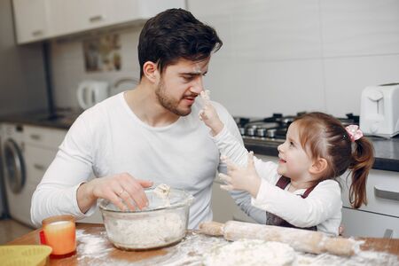 Family cook the dough for cookiesの写真素材