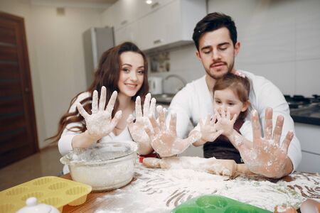 Family cook the dough for cookiesの写真素材