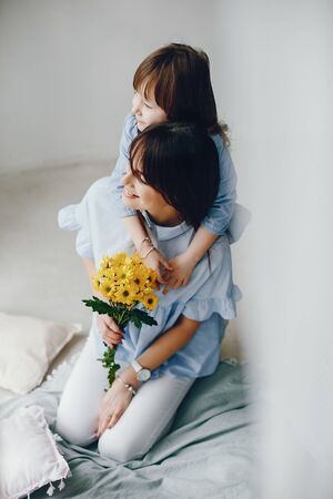 Mother with little child at homeの写真素材