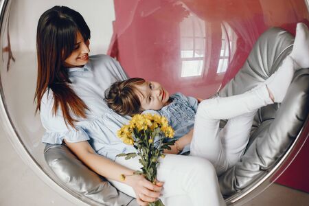 Mother with little child at homeの写真素材