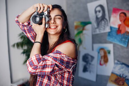 Fashion girl standing in a studioの写真素材