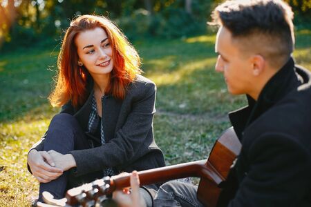 Beautiful couple spend time in a summer parkの写真素材