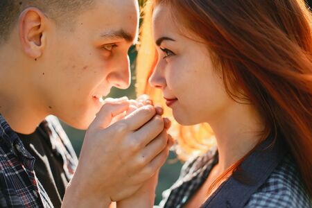 Beautiful couple spend time in a summer park
