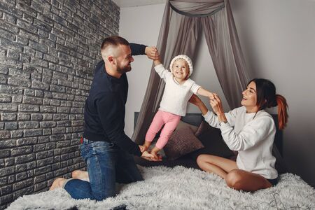 Father and mother with little daughterの写真素材
