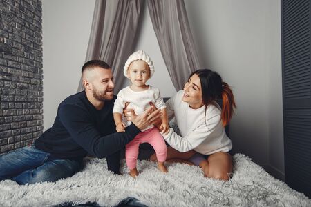 Father and mother with little daughterの写真素材