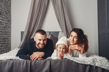 Father and mother with little daughter