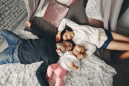 Father and mother with little daughterの写真素材