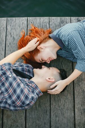 Beautiful couple spend time near a water