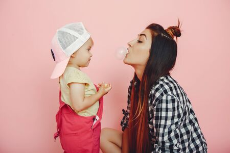 Mother and daughter have fun in a studioの写真素材