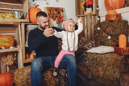 Happy father sitting with his little daughterの写真素材