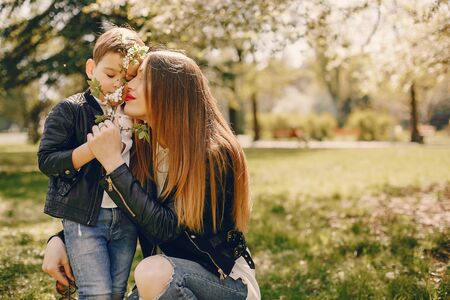 Mother with son playing in a summer parkの写真素材