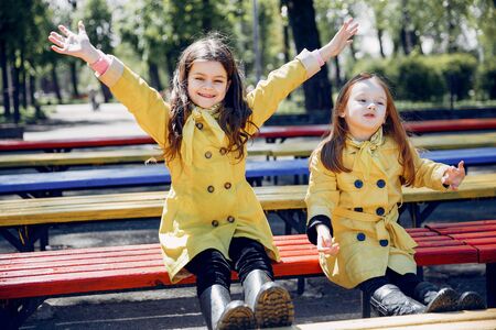 Cute kids plaiyng on a rainy dayの写真素材