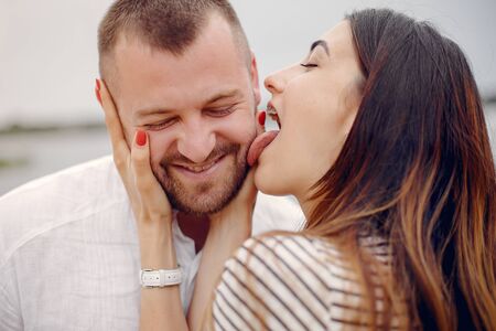 Beautiful couple spend time in a summer parkの写真素材