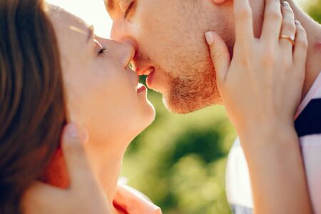 Beautiful couple spend time on a summer fieldの写真素材