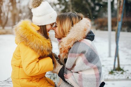 Mother with daughter in a park