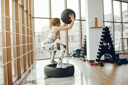 sporty girl in a gymの写真素材