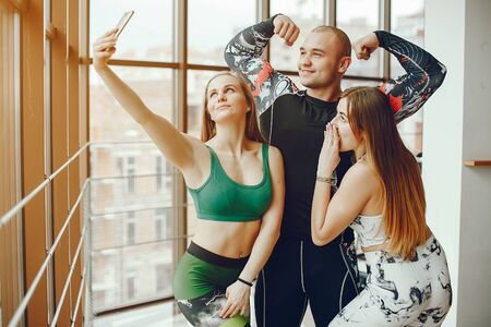 sporty friends in a gymの写真素材