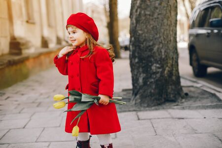 litlle girl with flowersの写真素材
