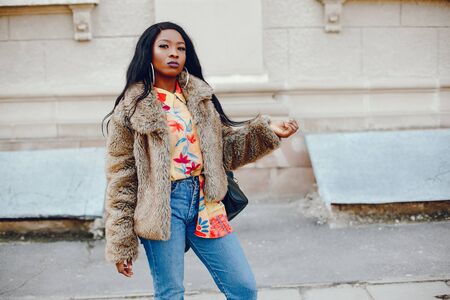 stylish black girl in a cityの写真素材
