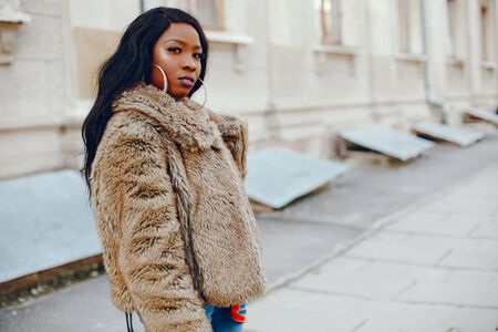 stylish black girl in a cityの写真素材