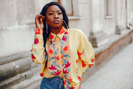 stylish black girl in a cityの写真素材