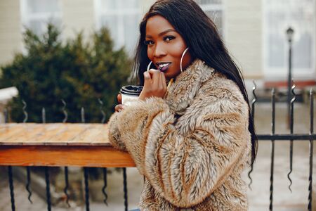 stylish black girl in a cityの写真素材
