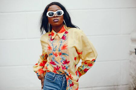 stylish black girl in a cityの写真素材