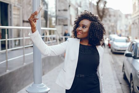 stylish black girl in a cityの写真素材