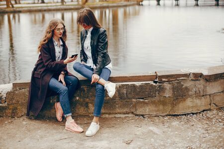 two stylish girl in a cityの写真素材