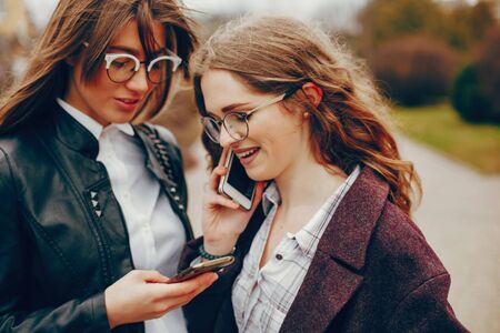 two stylish girl in a cityの写真素材