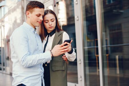 cute couple in a cityの写真素材